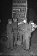 Soldiers at railway station; probably 1940.