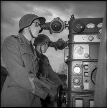 Soldiers at controls for anti aircraft guided arm, Berne 1951.