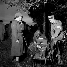 Female soldier talking on telephone by radio transmitter, Frauenfeld 1952.