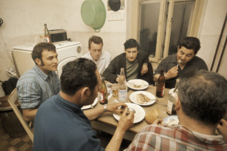 Immigrants having a meal.