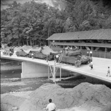 New Wynigen bridge beside of the old wooden roofed bridge, load test; 1961.