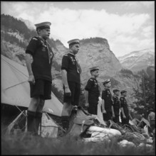 English boy scouts standing at attention in Kandersteg, 1950.