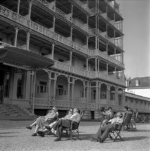 Tourists relaxing in Leysin, mountain health resort; 1956.