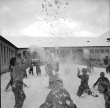 Snowball fight, battle at schoolyard, Zurich-Wiedikon 1955.