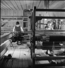 Women working in weaving mill in the Münstertal, 1946.