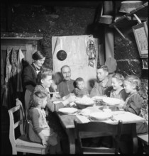 Family eating together, 1946.