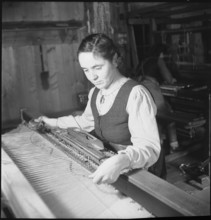 Woman working in weaving mill in the Münstertal, 1946.
