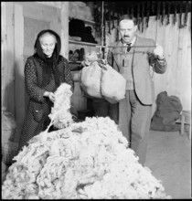 Man and woman weighing wool, 1945.