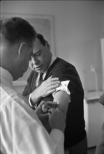 Blick employee getting vaccination against influenza, 1968.