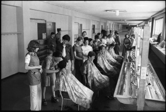 Hairdressers cutting hair of recruits 1975.