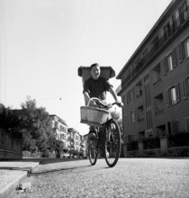 Boy delivering bread, 1949.