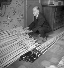 Man with hail defense rockets, 1951.