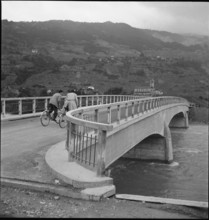 Bikers on the new ferroconcrete bridge across the Rhone river near Noes 1949.