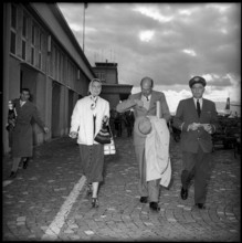 Arrival of ex-king Humbert II of Italy (c) with his wife Marie José in Geneva, 1954.