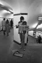 1975, Paris, subway, street musician.