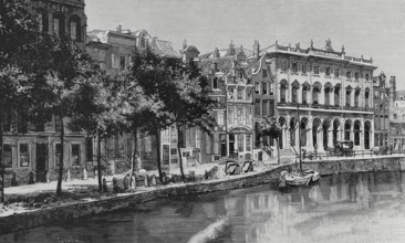 Amsterdam, Netherlands. Nieuwezijds Voorburgwal street and canal with the Royal Post Office on the