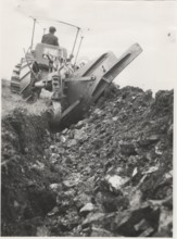 Reforestation a tractor machine preparing the field