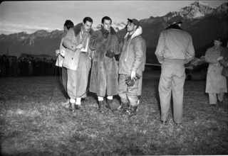 Rescued Dakota passengers at Unterbach military airfield, reporter interviews passenger; 1946.