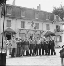 WW 2: Swiss and French clinking glasses, border St. Julien 1944.