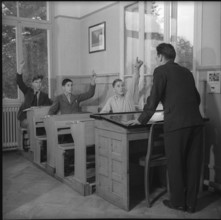 Male Teenagers and Teacher in Community Home.