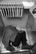 Sleeping homeless person in Zurich's shopville, 1971.