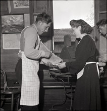 Preparing Raclette cheese on St. Barbara day in Salins.