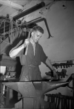 Blacksmith at the Anvil, 1950.
