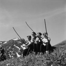 Farmer family with poles, 1955.
