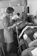 UPI office, telexist at telex terminal, 1970.