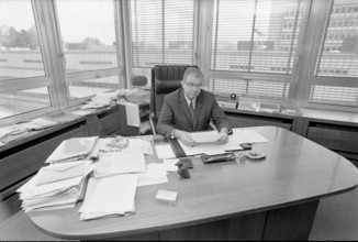 SDA managing director Georges Duplain in his office, 1971.