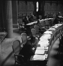 Swiss Federal Parliament; members of parliament using headphones; 1946.