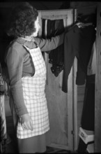 Hanging up the washing in a trailer 1942.