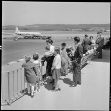 Gerold Zust with Hungarian children at airport Kloten 1957.
