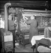 Silk ribbon weavers working, 1948.