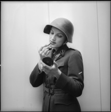 Woman soldier putting lipstick on, Zurich 1973.