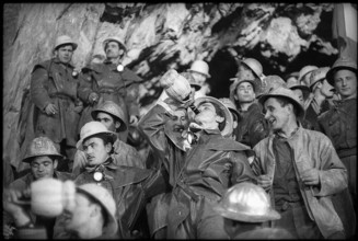 Cheering among the miners at breakthrough, Grand-St-Bernard 1962.
