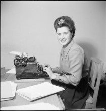 Woman works in Office 1946.