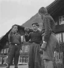 Boys making music with wood pieces, 1943.
