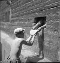 Men baking bread in St. Luc, Valais, in 1941.