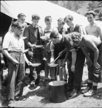 Serving of meals in a camp; 1944.