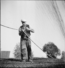 Fisherman from Lake Constance repairing net 1945.