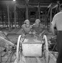 Workers at building site; 1953.