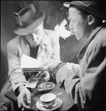 Black marketeering, marketeer dealing with food ration cards; 1942.
