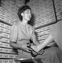 Saleswoman in Shoe Shop, 1953.