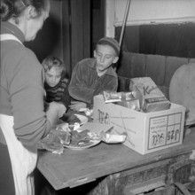 Hungarian refugees eating chocolate Uerikon 1956.