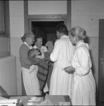 Red Cross aid worker with Hungarian child, Buchs 1956.
