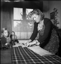 Woman making a dress, Basel 1949.