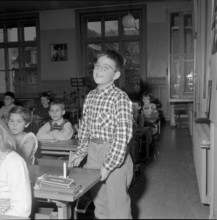 School boy with christmas present for children in Hungary, Zurich 1956.