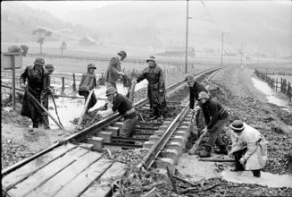 Soldiers reparing bad weather damages of railroad track 1969.