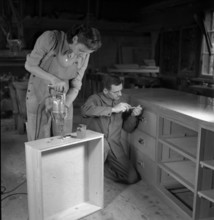 Young woman working in a carpenter's workshop; 1949.
